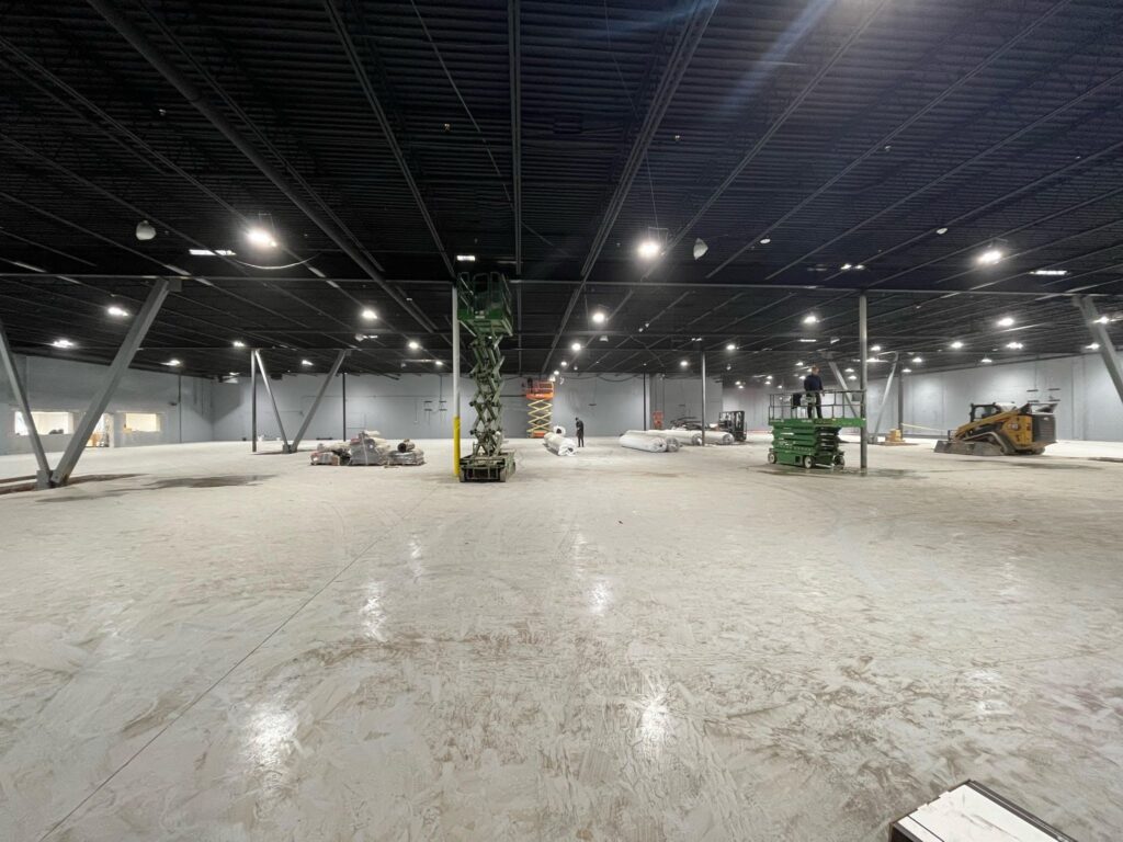 Steel fabrication team installing structural steel framing for a large industrial construction project