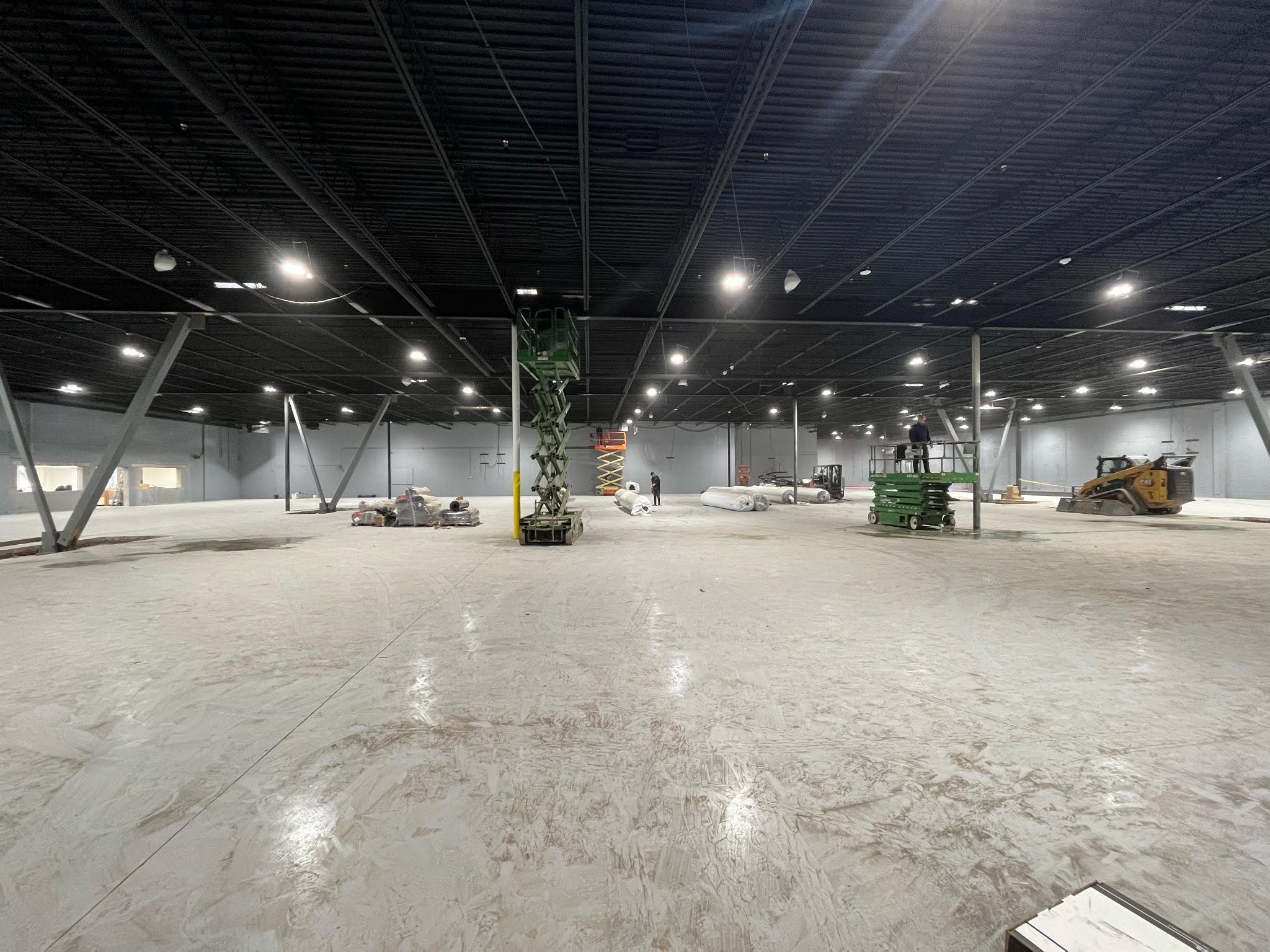 Steel fabrication team installing structural steel framing for a large industrial construction project